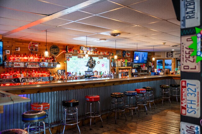 The interior to Cuda's features everything automobile from license plates to oil can tables.