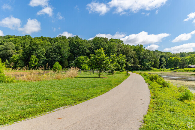 Swan Lake has a paved path for wildlife viewing at Dunbar Cave State Park.