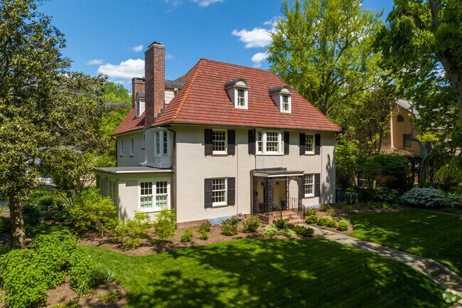 A lovely French Revival home with a freshly trimmed lawn in Wawaset.