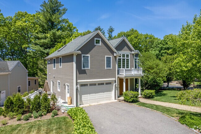 Single family homes with garages and driveways are typical in the Oak Hill neighborhood.