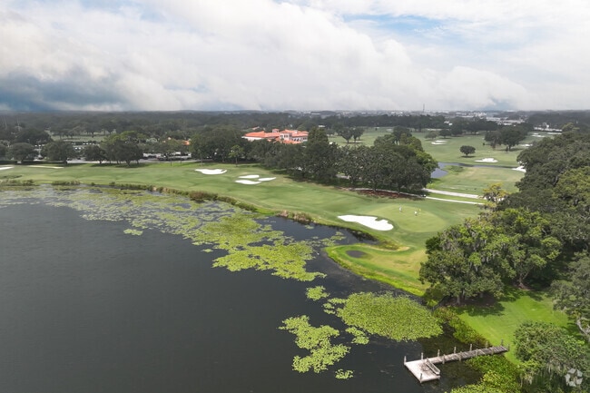 Sweeping aerial views capture Spring Lake alongside the lush fairways of MetroWest Golf Club.