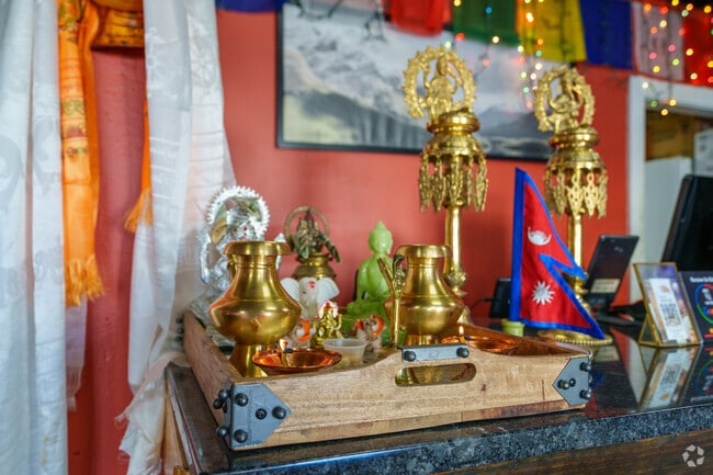 Experience the welcoming and warm ambiance inside Everest Momo & Pizza near Belmont.