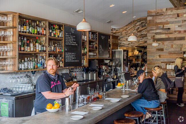 Outerlands has a nice bar for a cocktail with your meal.