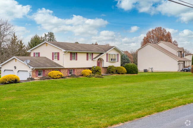 B-levles with two-car garages have spacious land and safe neighborhoods in Longswamp.