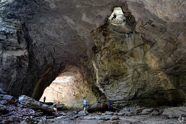 Carter Caves State Resort Park offers cave tours, nature hikes, and living history programs.