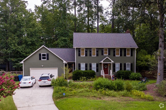 Homes sit on tree lined streets in the Arrowhead community in Durham, NC.
