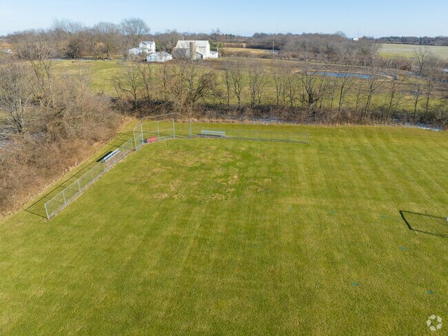 There is a baseball field for the students during the season.