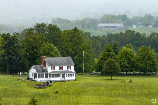 Several houses in Accord sit on acres of farmland.