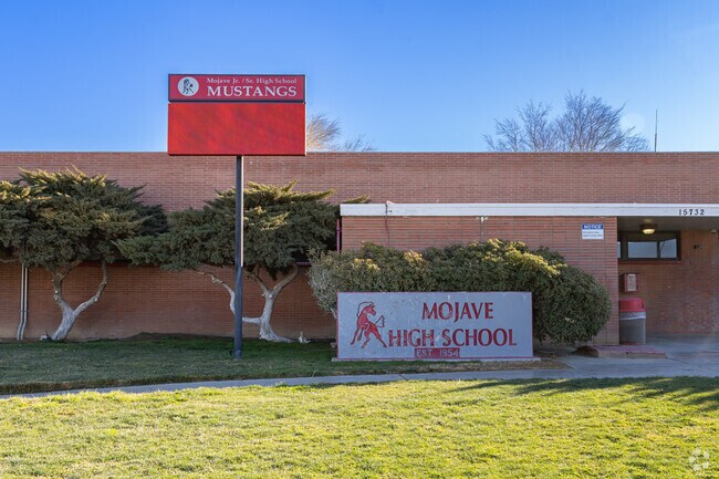 A lighted marquee at the entrance to Mojave High School informs parents about events.