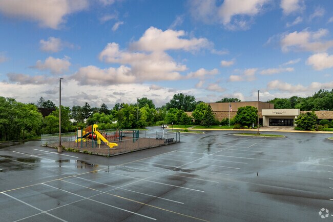 Transfiguration Elementary School has a playground in front of the school.