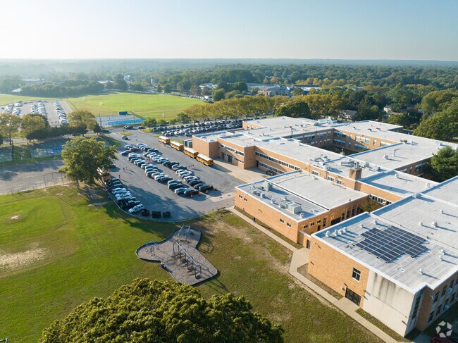 NID507906 Happague Middle School sits right next to Happague High School in a busy neighborhood.