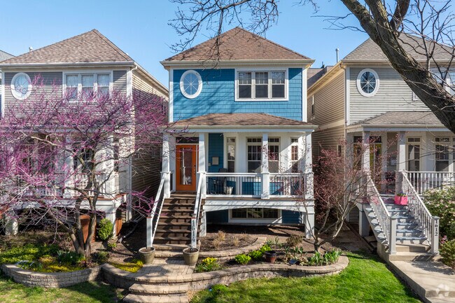 Andersonville homes are colorful and vibrant with green lawns and a walk up porches.