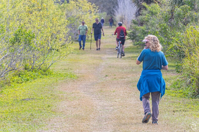 Red Bug Slough Preserve offers shaded walking trails and wildlife viewing.