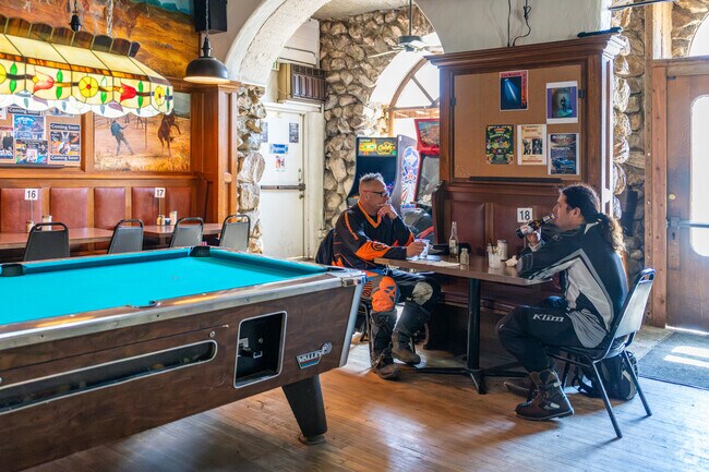 Customers enjoying conversation over a couple of beers at The Rock Inn in lake Hughes.