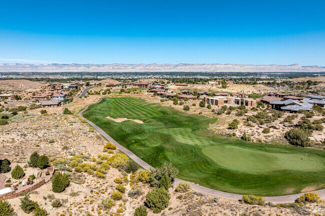 An aerial view shows a blend of golf and Redlands homes.