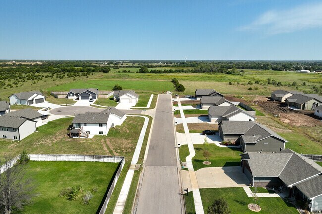 A typical Rose Hill street features ranch style homes and wide two-lane roads.