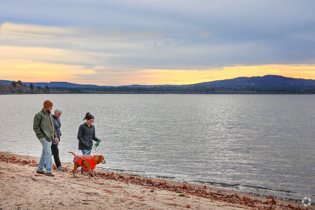 Ossipee Lake is a beautiful, expansive lake framed by mountains and forests.