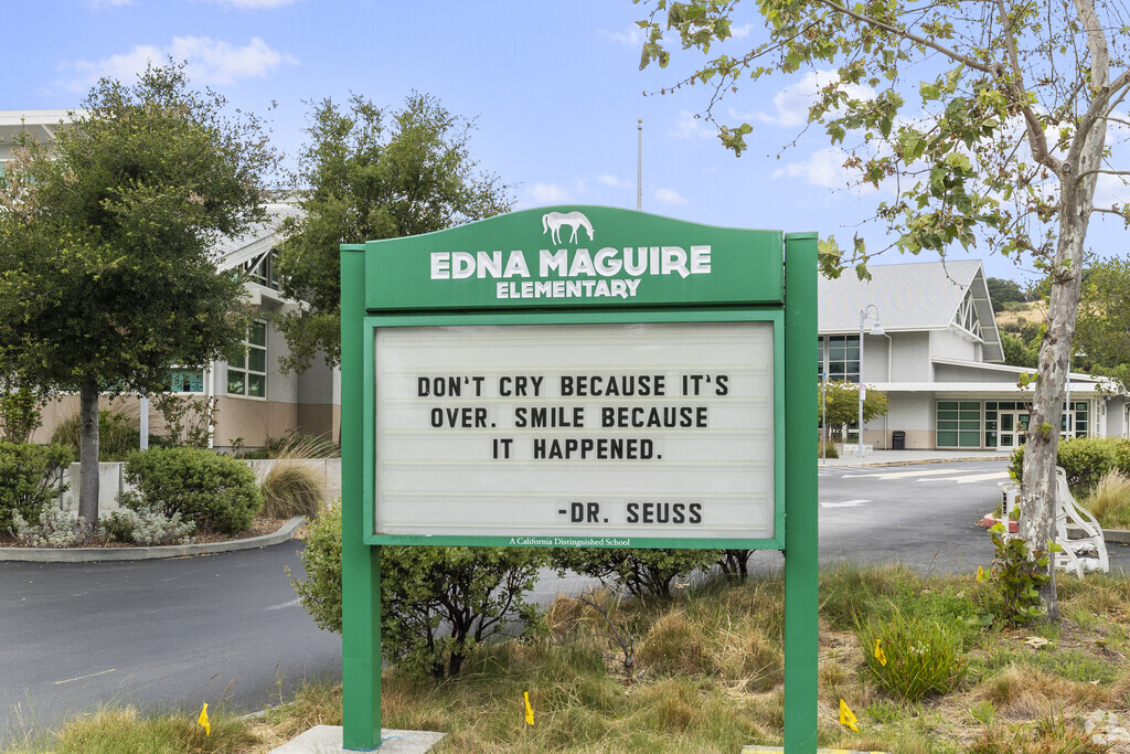 The Edna Maguire Elementary School sign features a Dr. Suess quote.