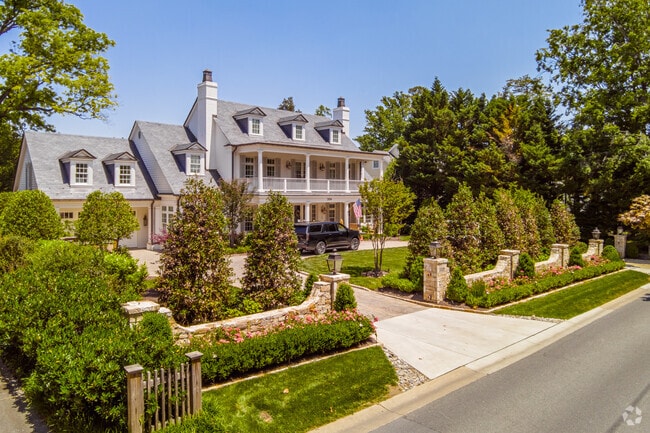 Beautifully manicured garden leading to an expansive Farmhouse in Chevy Chase Park.