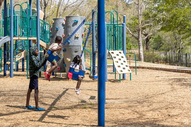 Joy in motion as someone soars through the sky at Azalea Park in Roswell.