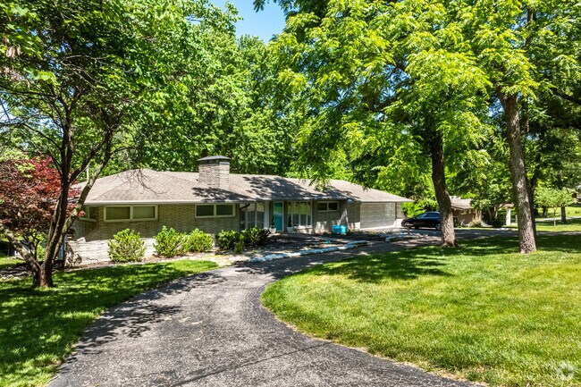 Some homes in Platte Woods have half circle driveways and large back yards.