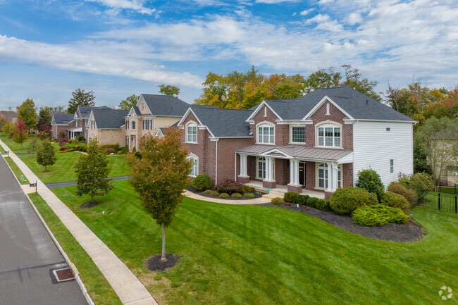 Single-family homes on manicured lots line Warrington’s residential streets.