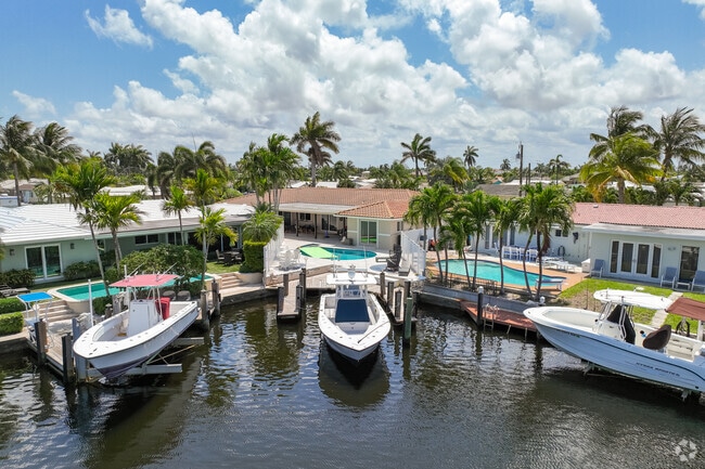 In Snug Harbor, residents can dock their boats right at home.