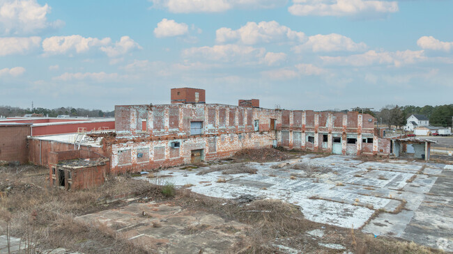 Parts of the old mill that employed most of Roanoke Rapids barely stands.