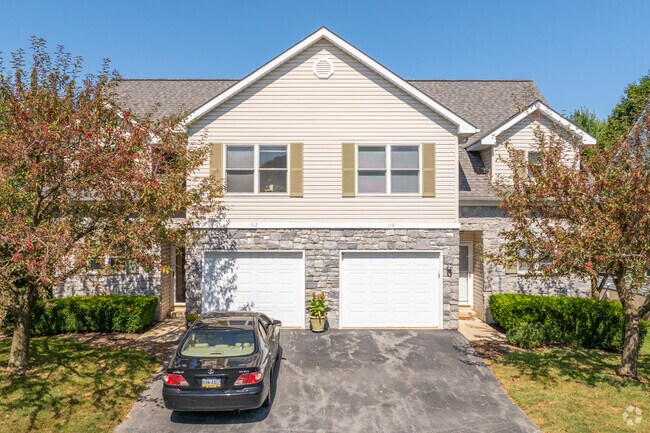 Townhomes in Ferguson Township sit side by side with single garage parking.