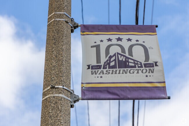 A sign celebrates 100 years of education at Washington Middle School.