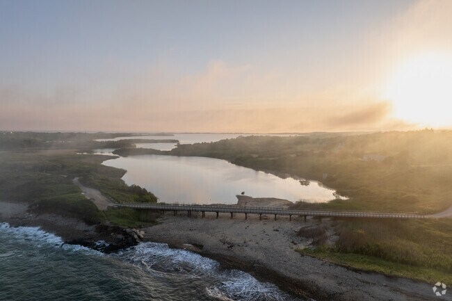 The setting sun reflects off Stonewall Pond in Chilmark.