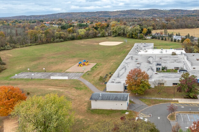 Patrick McGaheran School features a playground, basketball courts, and a baseball field.