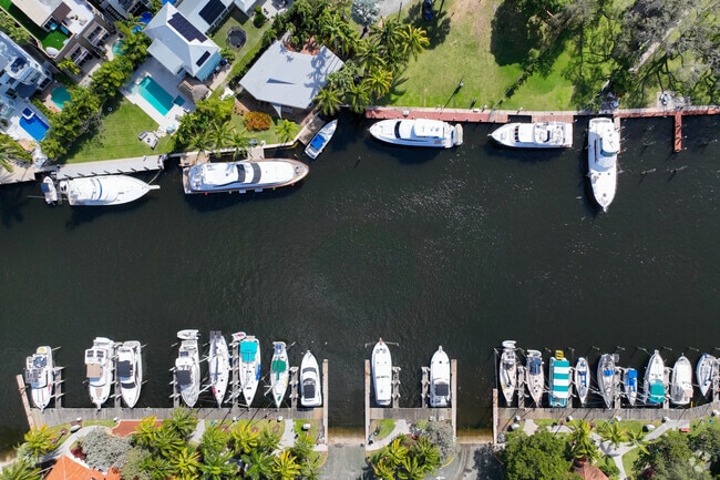 There are a variety of boats docked in Riverside Park from small fishing boats to yachts.