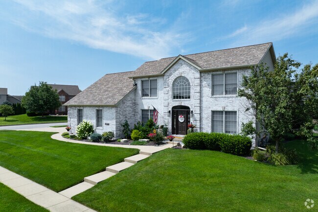 Two-story Colonial Revivals line Sedona Drive.