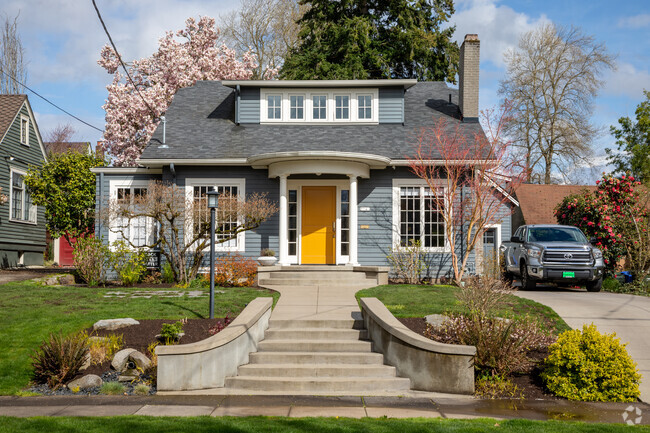 A bright front door invites visitors up the steps of a bungalow in Irvington.