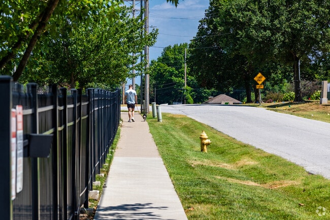 A Parkwood resident enjoys a morning walk with a faithful companion.
