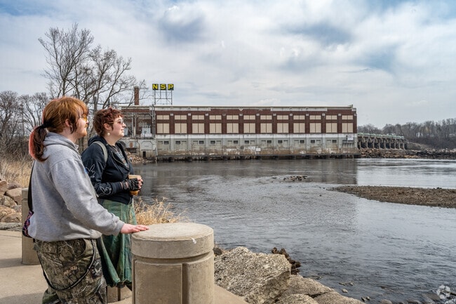 Residents enjoy the view of the Chippewa at Riverfront Park.