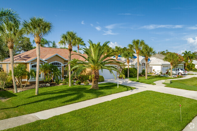 Homes in Edgewood are surrounded by palms and mature landscaping.