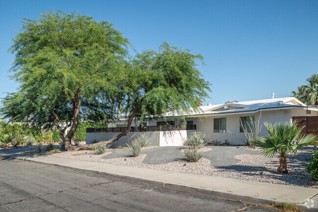 Tall trees help shade a Midcentury modern home in Vista Norte.