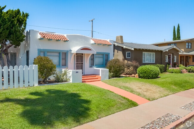 Light pink sidewalks lead to smaller Spanish Revival homes in Burlingame.