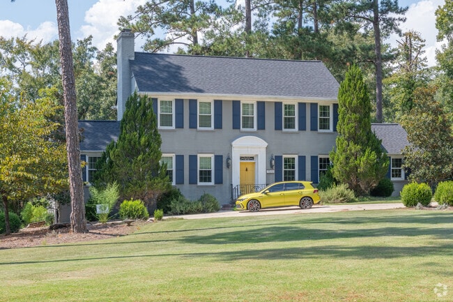 A newer colonial revival is well-placed in teh Shirley Hills Historic District neighborhood.