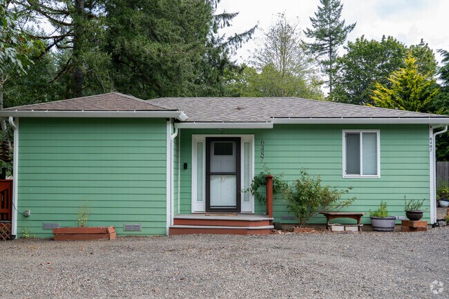 Colorful homes sprinkle the back roads of the Rose Lodge neighborhood.
