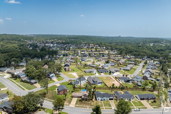 The Reservoir neighborhood includes tightly constructed houses along the hills and trees.