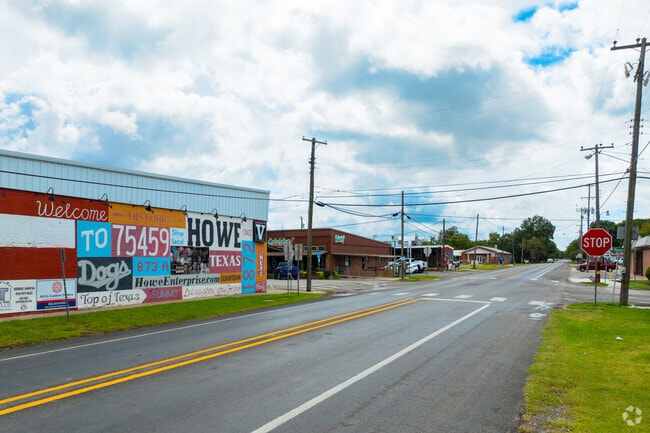 A 'Welcome to Howe' mural marks the corner of N Denny and E Haning.