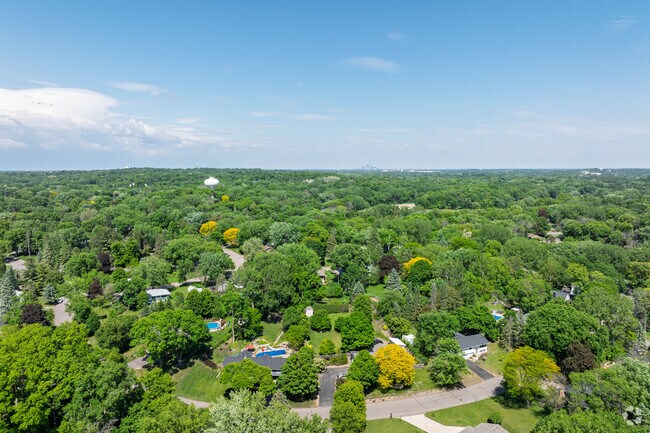 Tree-covered lots in Covington provide natural screening between homes, creating a private residential environment where split-levels and Colonial Revivals blend seamlessly with the landscape.