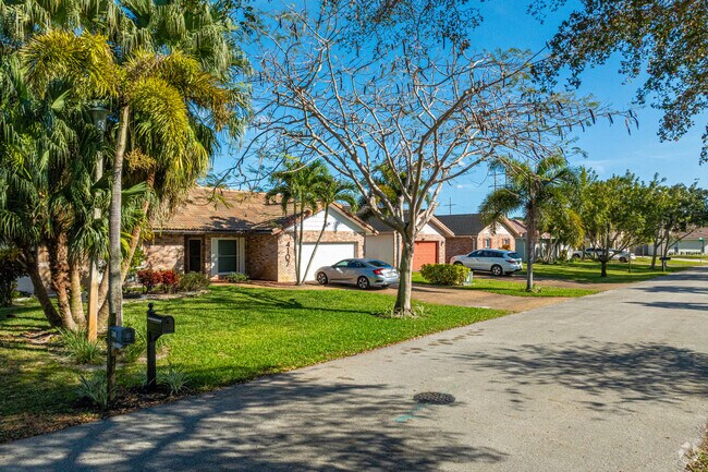Colorful row of ranch-style homes shows brick decoration in Crossings.