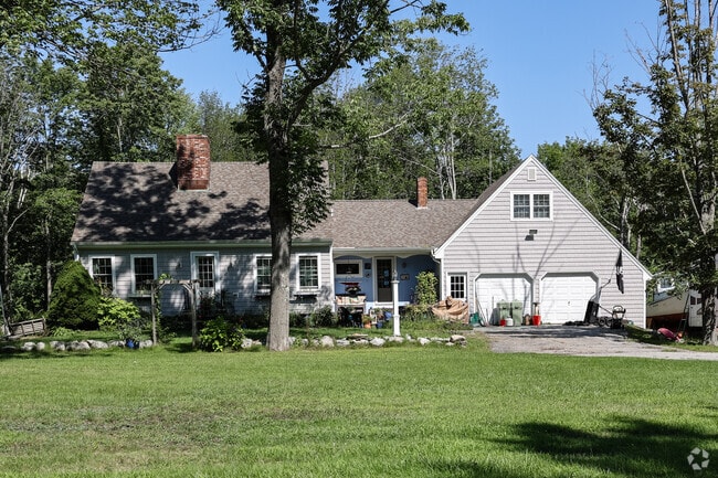 This Cape Cod with an attached garage can be found on Cousins Island.