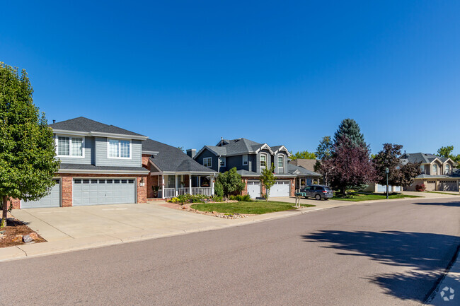A row of craftsman style homes line the street in the Legacy Ridge neighborhood.