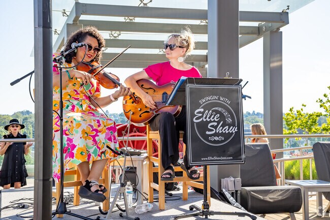 Ellie Shaw provides captivating swing music at the Toast to Tails fundraiser in downtown Boise.