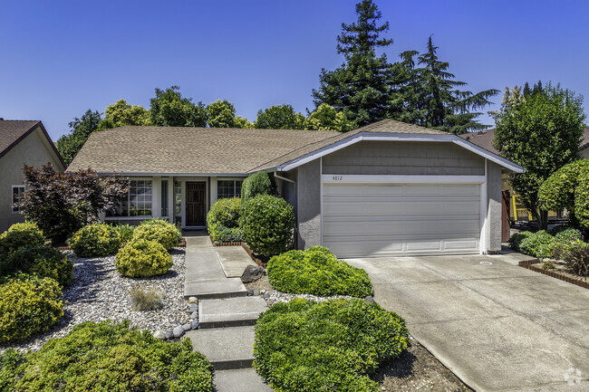 This ranch style home has low maintenance landscaping in Kirkland Place.